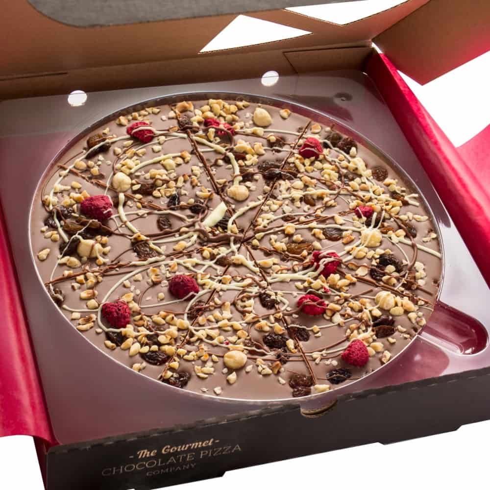 Our 10" Crazy Crunch Pizza, includes a milk chocolate base, topped with crunchy hazelnuts, juicy raisins and zingy raspberries.